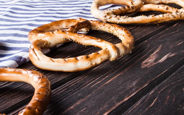 Bavarian pretzels on wooden board. — Stock Photo, Image