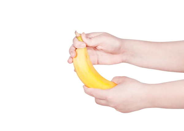 Mano femenina sosteniendo un plátano — Foto de Stock