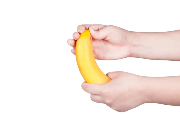 Mano femenina sosteniendo un plátano — Foto de Stock