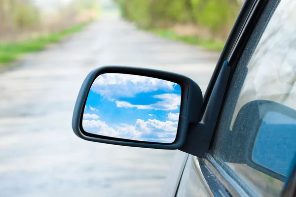 Car mirror with blue sky — Stock Photo, Image