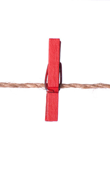 Red clothespins on a rope
