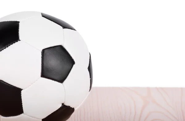 Pelota de fútbol en los tableros . — Foto de Stock