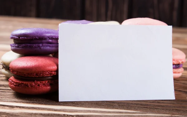 Multicolored macaroon on brown boards. — Stock Photo, Image