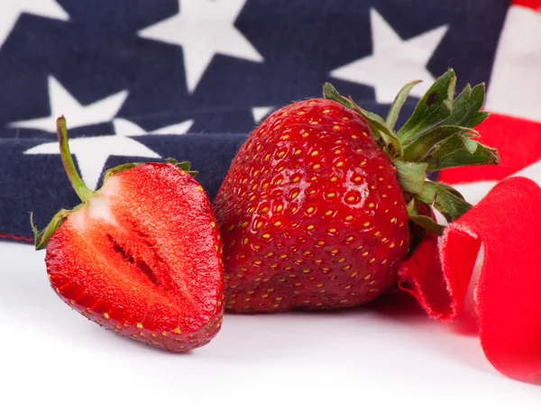 Ripe strawberry with flag — Stock Photo, Image