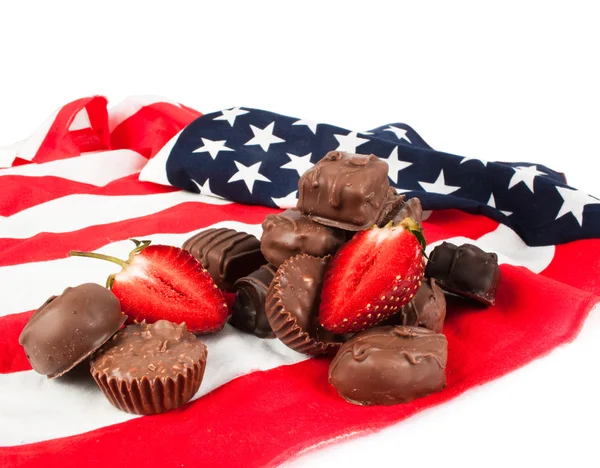 Chocolate candy on American flag — Stock Photo, Image