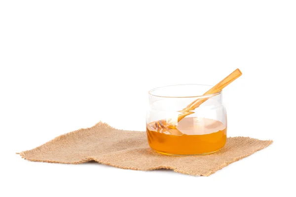 Jar of honey and  honey dipper — Stock Photo, Image