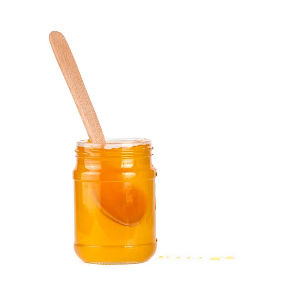 Jar of honey and  honey dipper — Stock Photo, Image
