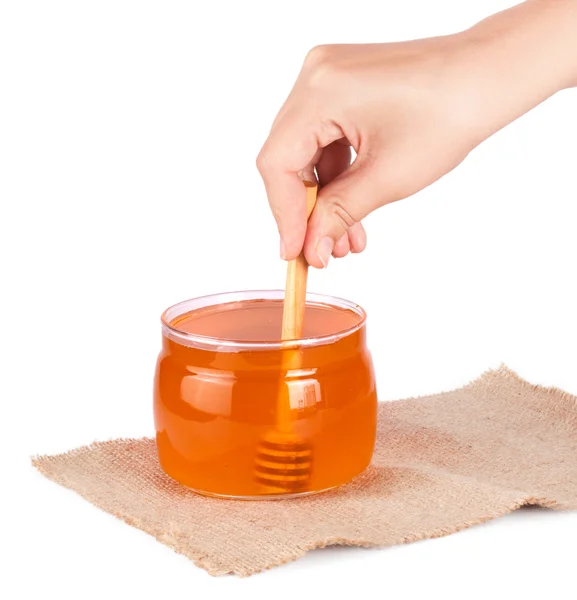 Jar of honey and  honey dipper — Stock Photo, Image