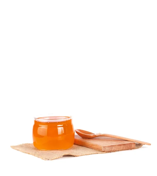 Jar of honey and  honey dipper — Stock Photo, Image