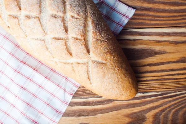 Loaf of bread on the boards — Stock Photo, Image