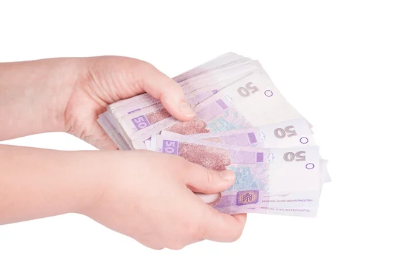 Dinero ucraniano desplegado en su mano — Foto de Stock