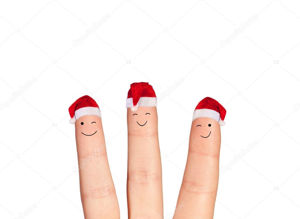 Fingers faces in Santa hats