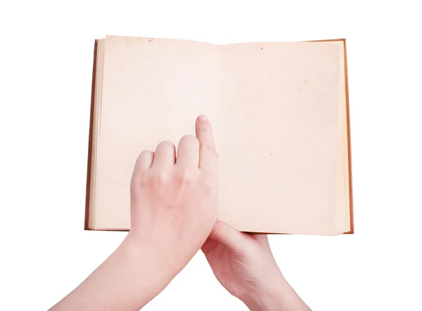 Bovenaanzicht van handen met een oud boek — Stockfoto