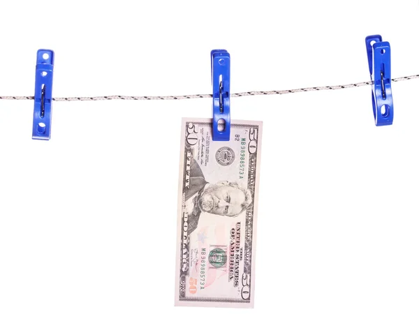 เงินดอลลาร์แขวนอยู่บนเชือกติดกับหมุดเสื้อผ้า — ภาพถ่ายสต็อก
