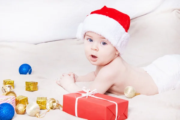 Beautiful little baby celebrates Christmas. — Stock Photo, Image