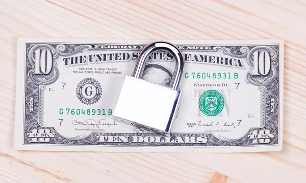 Safe secure locked stack of hundred dollar bills