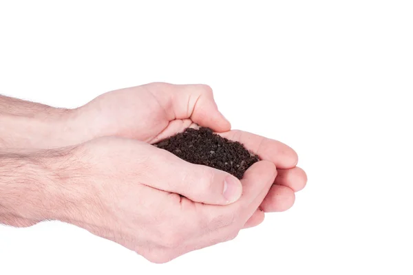 Mãos estão segurando solo jardim preto em close-up sobre backgr branco — Fotografia de Stock