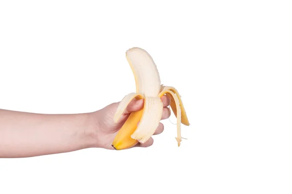 Рука женщины держит банан — стоковое фото