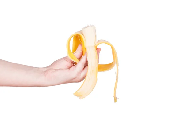 The woman's hand holds a banana — Stock Photo, Image