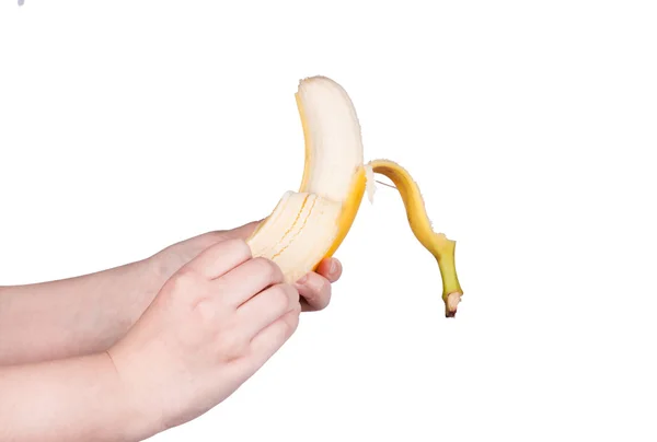 Kobieta w ręce trzyma banana — Zdjęcie stockowe
