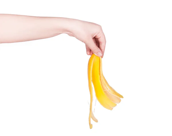 The woman's hand holds a banana — Stock Photo, Image