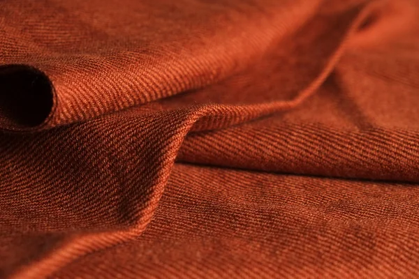 Folded dark orange scarf cloth — Stock Photo, Image