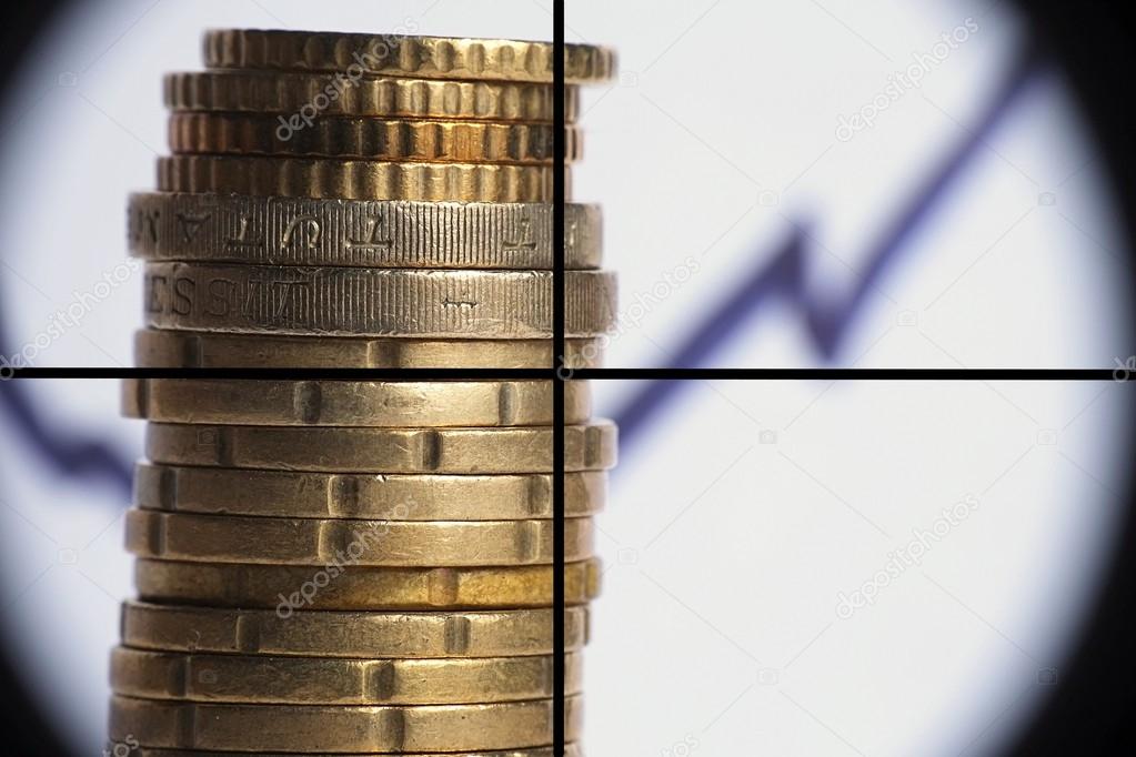 Coin stack with rising chart line, being aimed by a cross-sight sniper scope