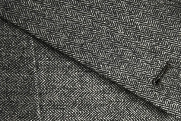 Solapa y bolsillo de un clásico abrigo de tweed gris — Foto de Stock