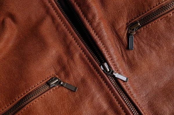 Zippers of a brown leather jacket — Stock Photo, Image