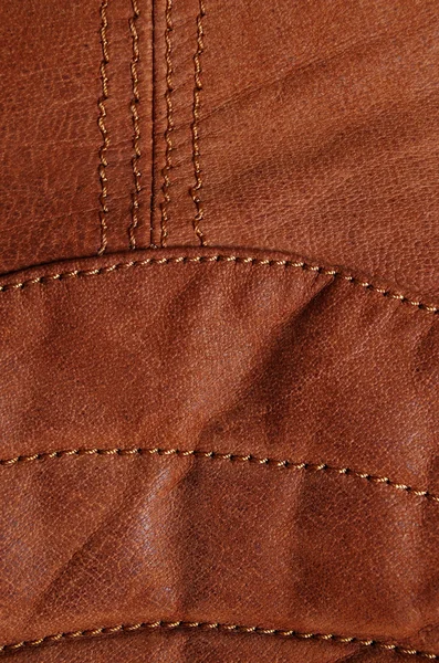 Seams in brown leather jacket. Lower back detail — Stock Photo, Image