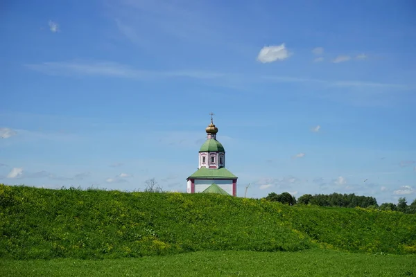 the Church of Elijah the Prophet behind the hill in Suzdal. Russia