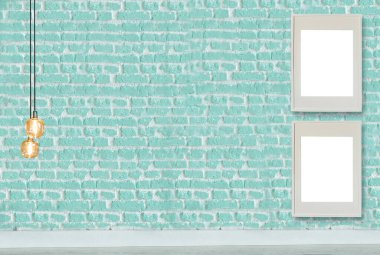 Yeni yeşil dekoratif tuğla duvar, boş çerçeve, modern lamba ve iç tasarım. ahşap zemin