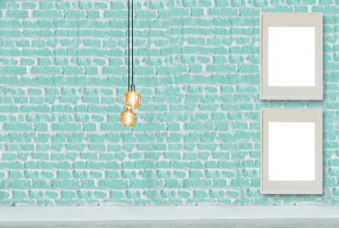 Yeni yeşil dekoratif tuğla duvar, boş çerçeve, modern lamba ve iç tasarım. ahşap zemin