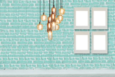 yeşil dekoratif tuğla duvar, boş çerçeve, modern lamba ve iç tasarım. ahşap zemin