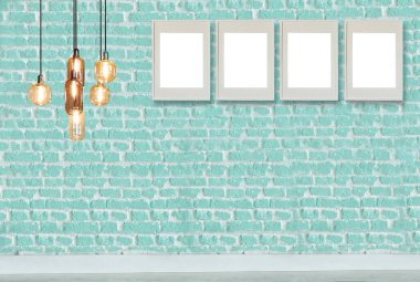 yeşil dekoratif tuğla duvar, boş çerçeve, modern lamba ve iç tasarım. ahşap zemin