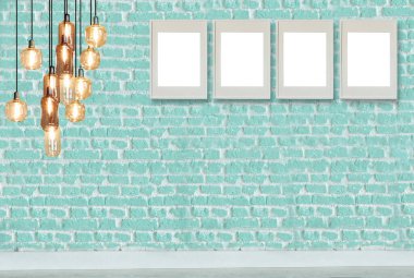yeşil dekoratif tuğla duvar, boş çerçeve, modern lamba ve iç tasarım. ahşap zemin