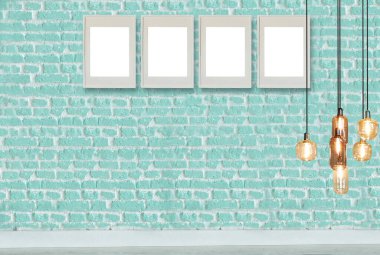 yeşil dekoratif tuğla duvar, boş çerçeve, modern lamba ve iç tasarım. ahşap zemin