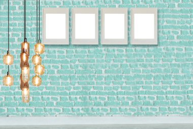 yeşil dekoratif tuğla duvar, boş çerçeve, modern lamba ve iç tasarım. ahşap zemin