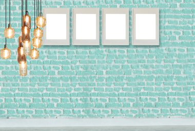 yeşil dekoratif tuğla duvar, boş çerçeve, modern lamba ve iç tasarım. ahşap zemin