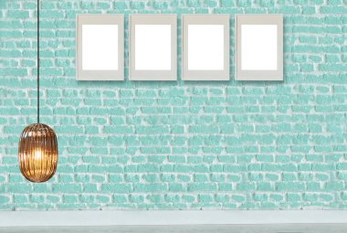 yeşil dekoratif tuğla duvar, boş çerçeve, modern lamba ve iç tasarım. ahşap zemin