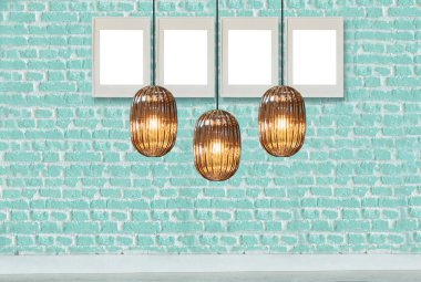 yeşil dekoratif tuğla duvar, boş çerçeve, modern lamba ve iç tasarım. ahşap zemin