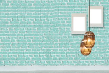 yeşil dekoratif tuğla duvar, boş çerçeve, modern lamba ve iç tasarım