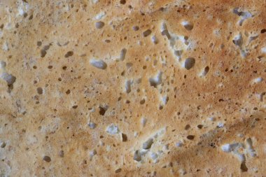 Taze kahverengi ekmek somununun yüzeyine yakın çekim