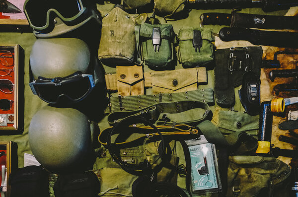 Military helmets on table