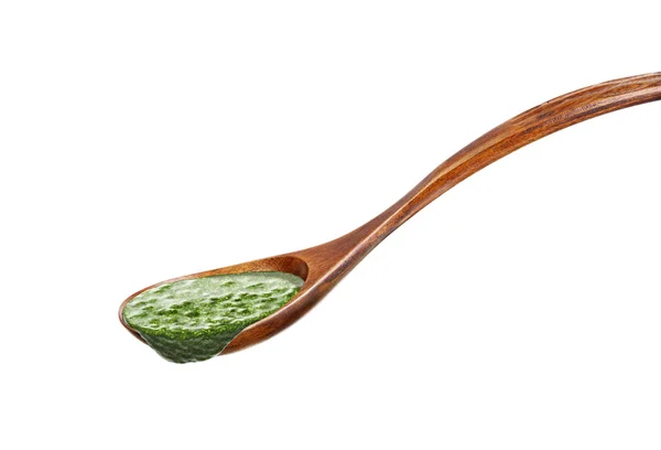 Wooden spoon with pesto sauce — Stock Photo, Image