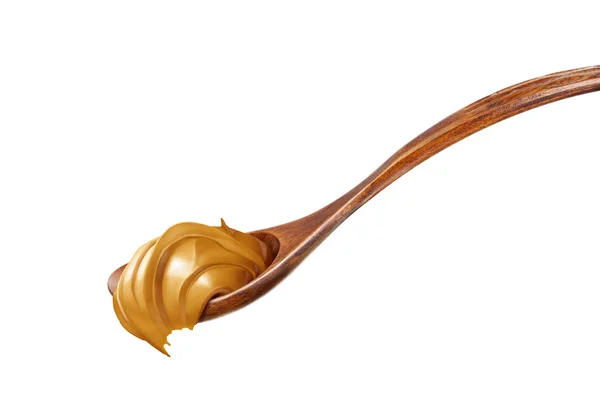 Деревянная ложка с арахисовым маслом — стоковое фото