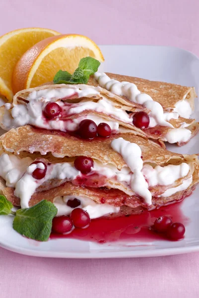 Pancakes with sour cream — Stock Photo, Image