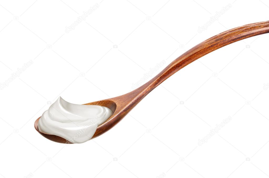 Wooden spoon with joghurt