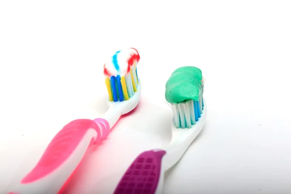 Toothbrush with toothpaste on a white background — Stock Photo, Image