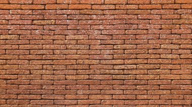 A reddish brown laterite brick wall. Attractive antique red brick wall texture for background designs with copy space. Selective focus clipart
